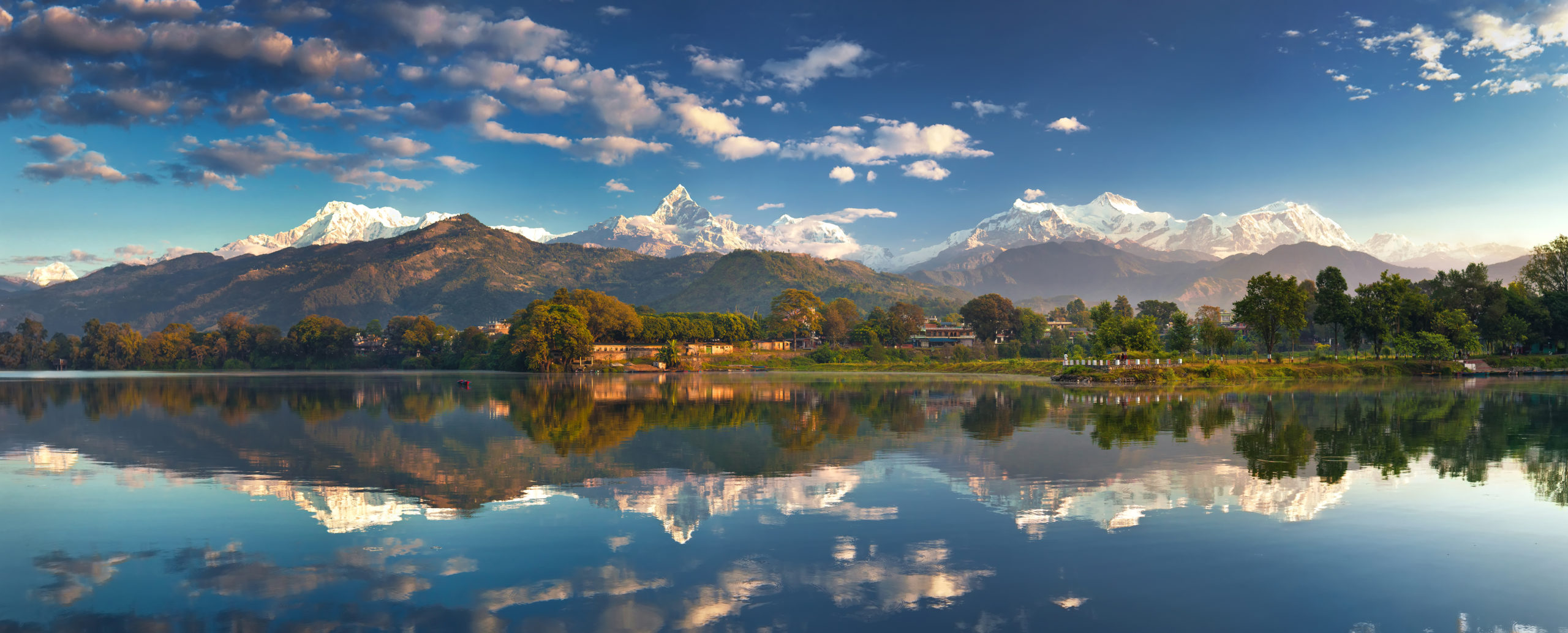 Incredible Himalayas. Panoramic view from the lakeside at the foothills of the magnificent Annapurna mountain range.