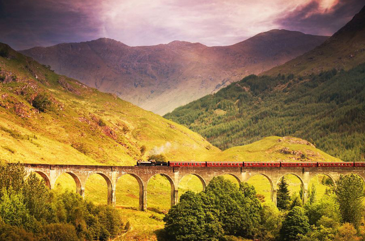 Jacobite steam train crossing Glenfinnan viaduct