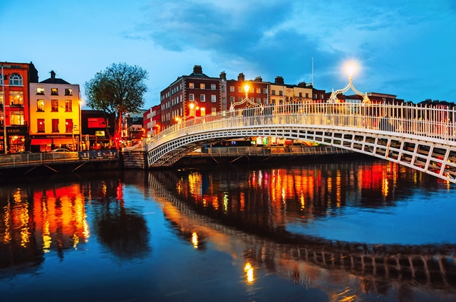 Dublin, Ireland. Night view of famous illuminated Ha Penny Bridge