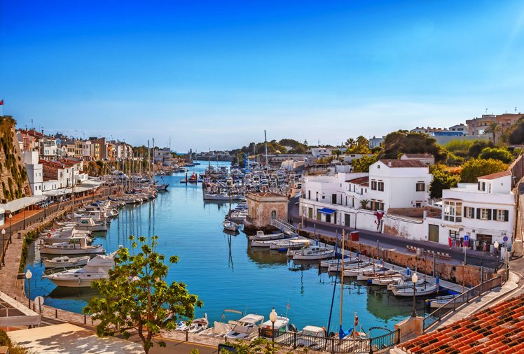 View on old town Ciutadella port on sunny day, Menorca island, Spain.