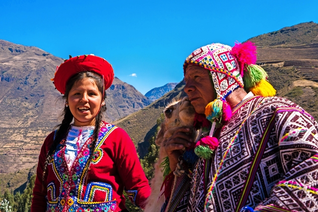 Native Peruvian group with their Llama in Sacred Valley, Cusco, Peru