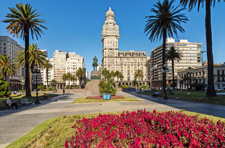 MONTEVIDEO, URUGUAY - FEBRUARY 04, 2018: Plaza indepedencia with the building Palacio Salvo and the statue of Jose Artigas in Montevideo, Uruguay.