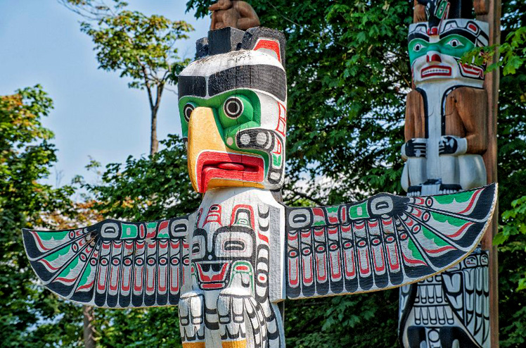 totem wood pole in the blue sky background