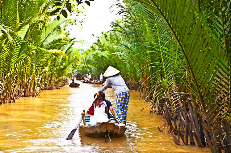 BEN TRE, VIETNAM-NOV 18, 2013: A famous tourist destination is  Ben Tre village on Nov 18, 2013. in Mekong delta , Vietnam. Mekong Delta is home of people who live along the many channels.
