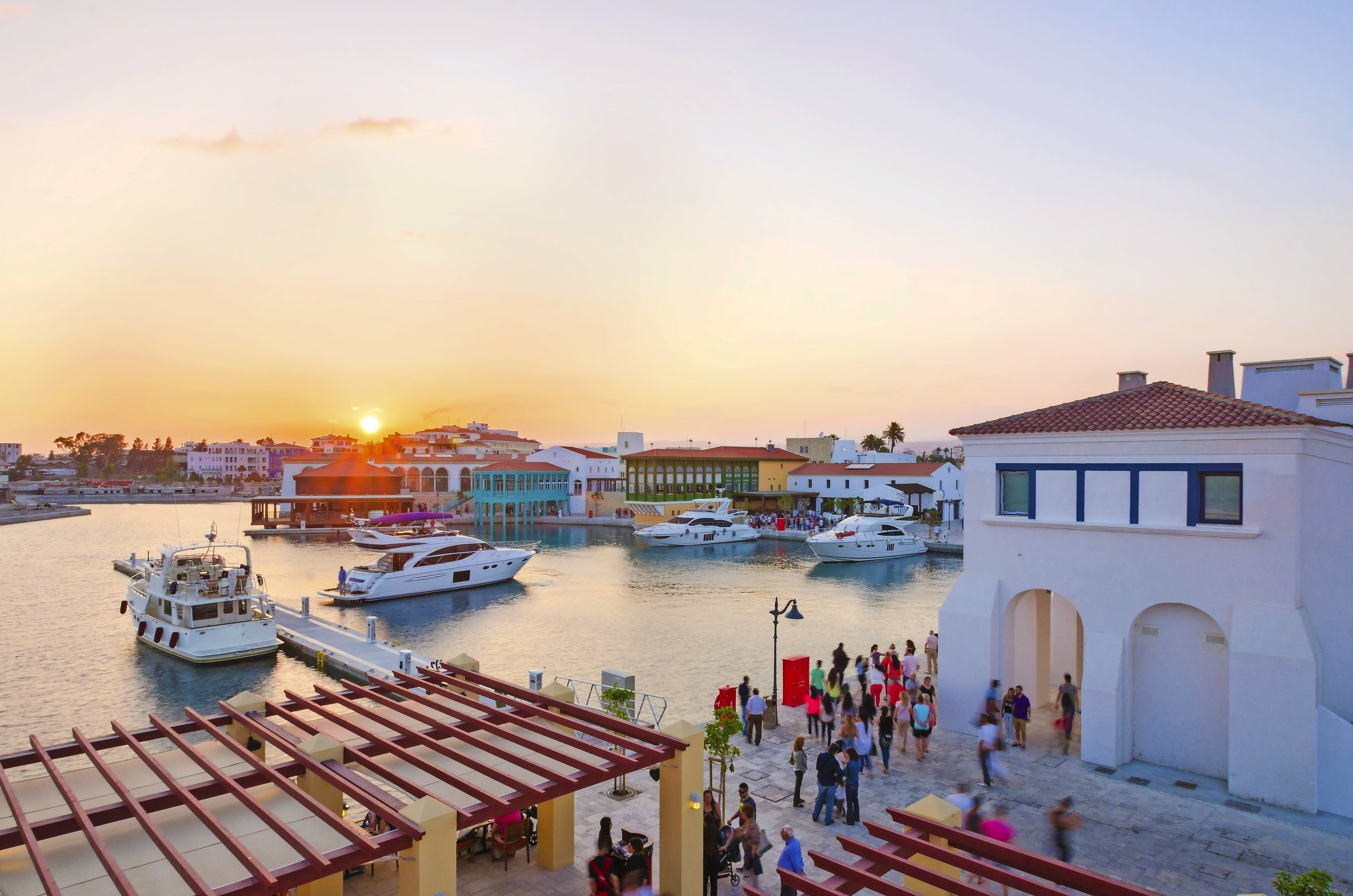 The beautiful Marina in Limassol city in Cyprus. A very modern, high end and newly developed area where yachts are moored and it's perfect for a waterfront promenade. A view of the commercial area at sunset.